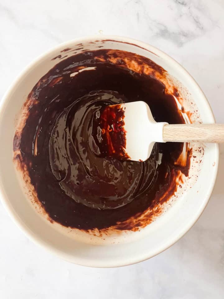 The ganache is stirred.