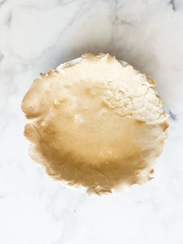 Crust is placed in the pie pan.