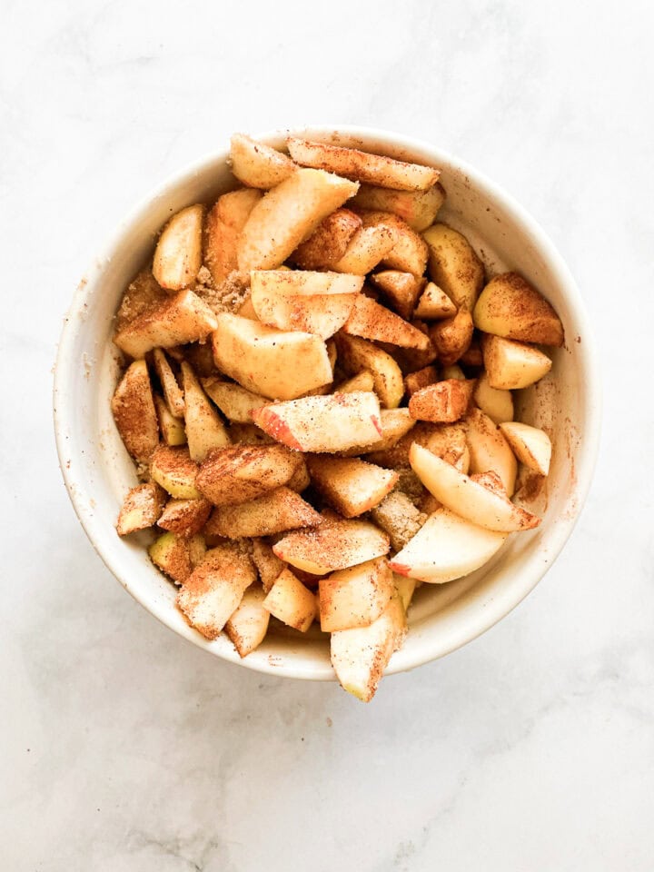 Gravenstein apple pie filling is mixed together.