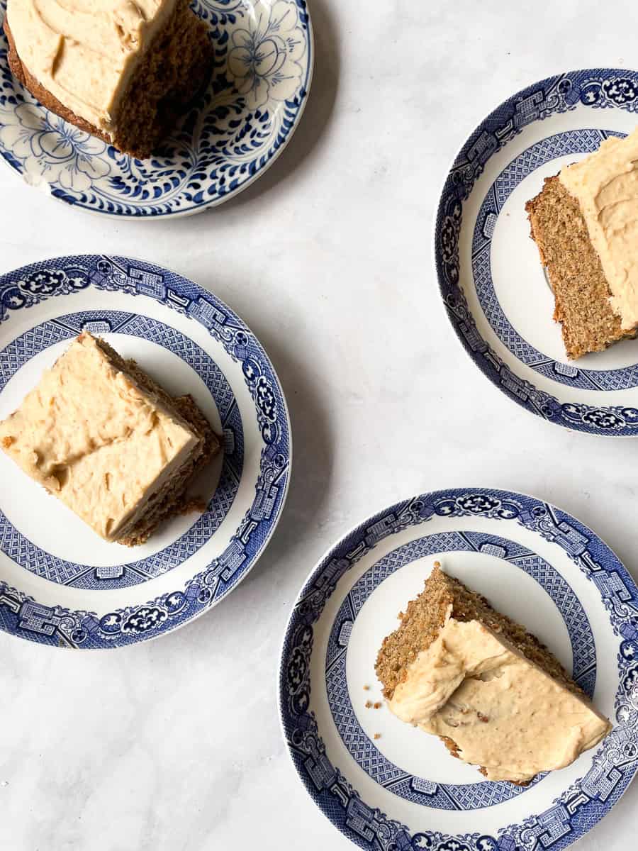 Four pieces of banana peanut butter cake on plates.