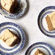 Four pieces of banana peanut butter cake on plates.