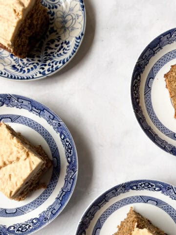 Four pieces of banana peanut butter cake on plates.