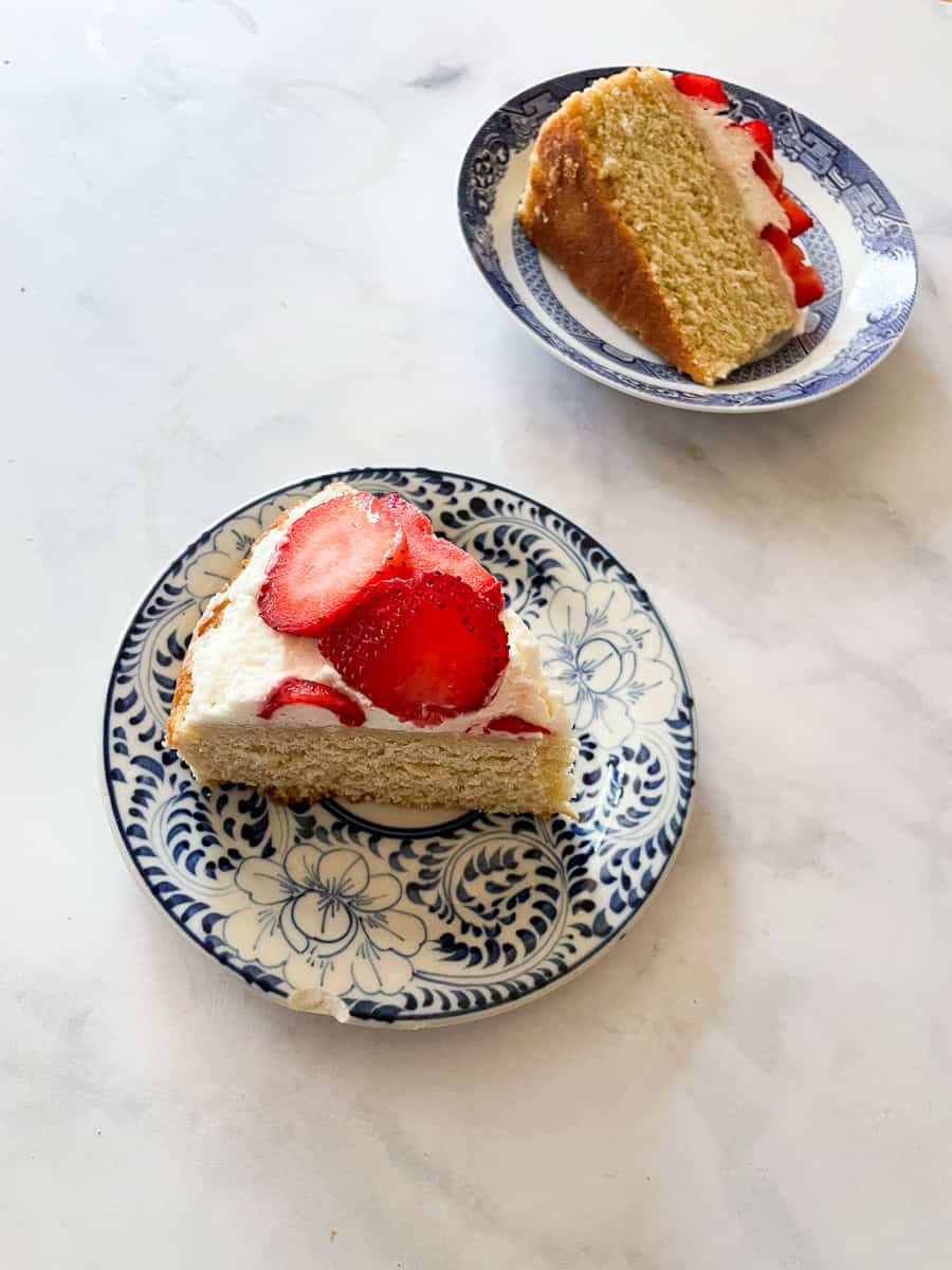 Two pieces of gluten free strawberry shortcake cake.