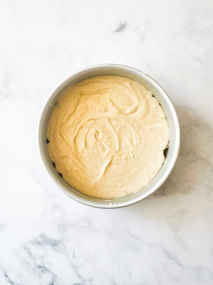 Cake batter rests in a pan.