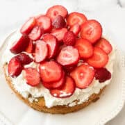 Sliced strawberries top gluten free strawberrry shortcake.