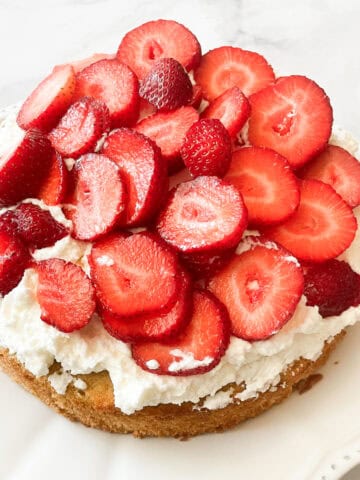 Sliced strawberries top gluten free strawberrry shortcake.