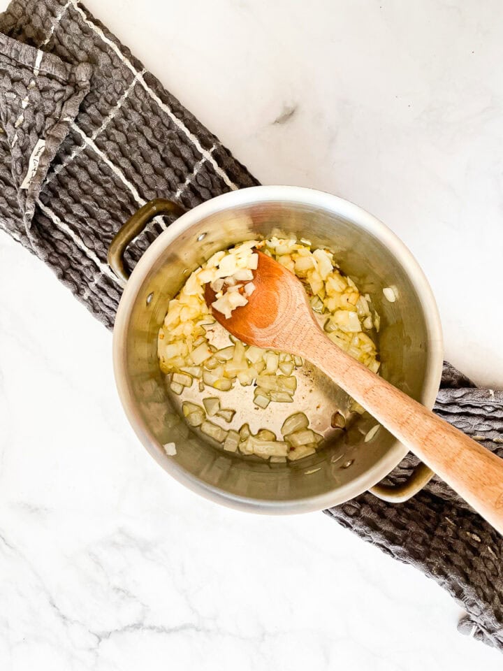 Garlic and onion cook down.