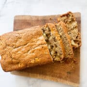 A loaf of gluten free apple cinnamon bread cut into slices.