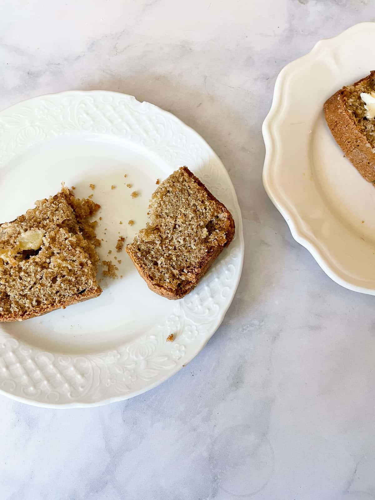 Slices of apple cinnamon bread on plates.