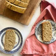 Slices of gluten free applesauce bread on plates.