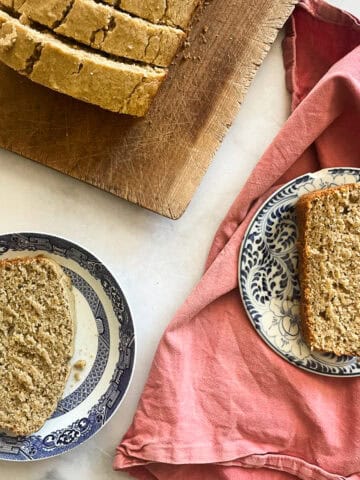 Slices of gluten free applesauce bread on plates.