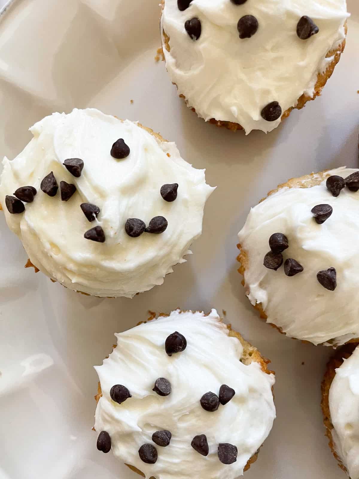 A plate of gluten free chocolate chip cupcakes.