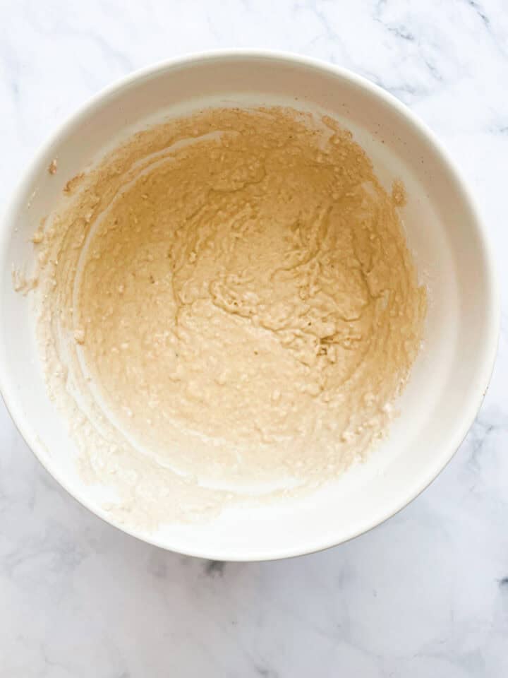 Gluten free banana buttermilk pancake batter rests in a bowl.