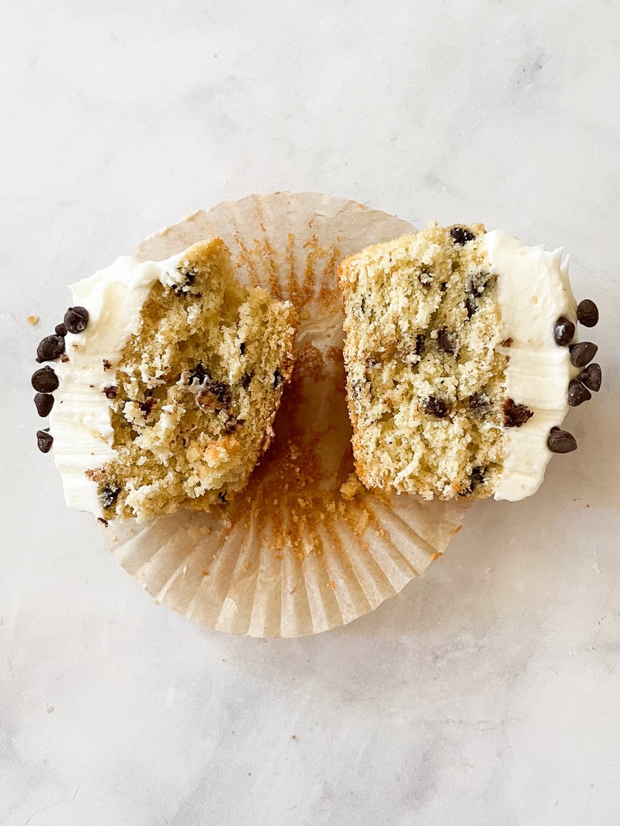 Two halves of a cupcake split open.