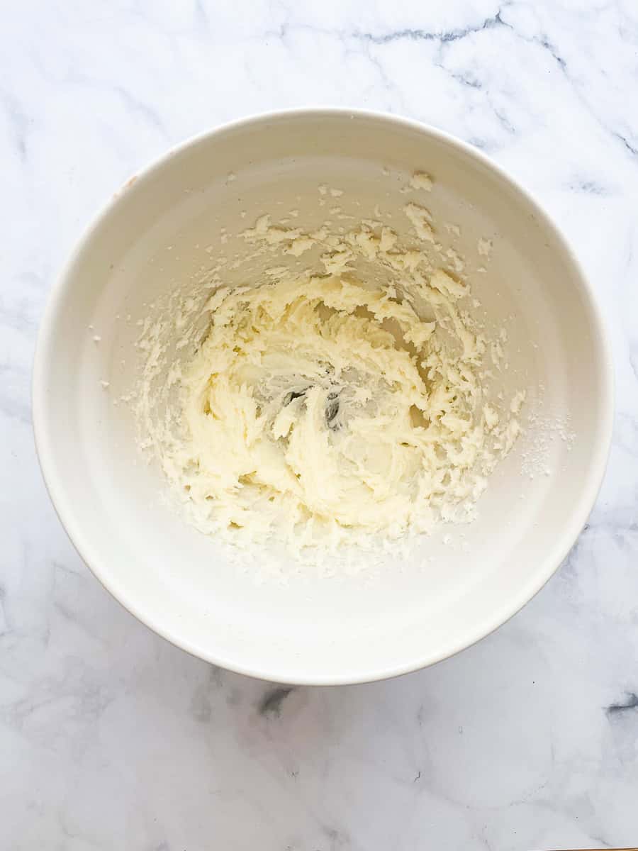 Butter and sugar creamed in a bowl.