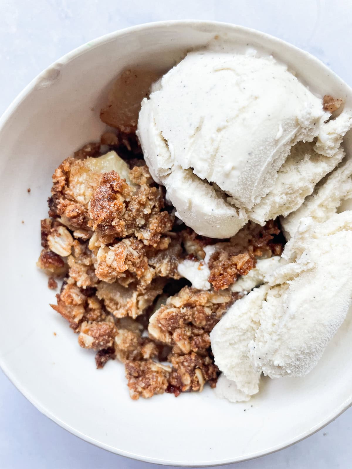 Ice cream tops apple crisp.