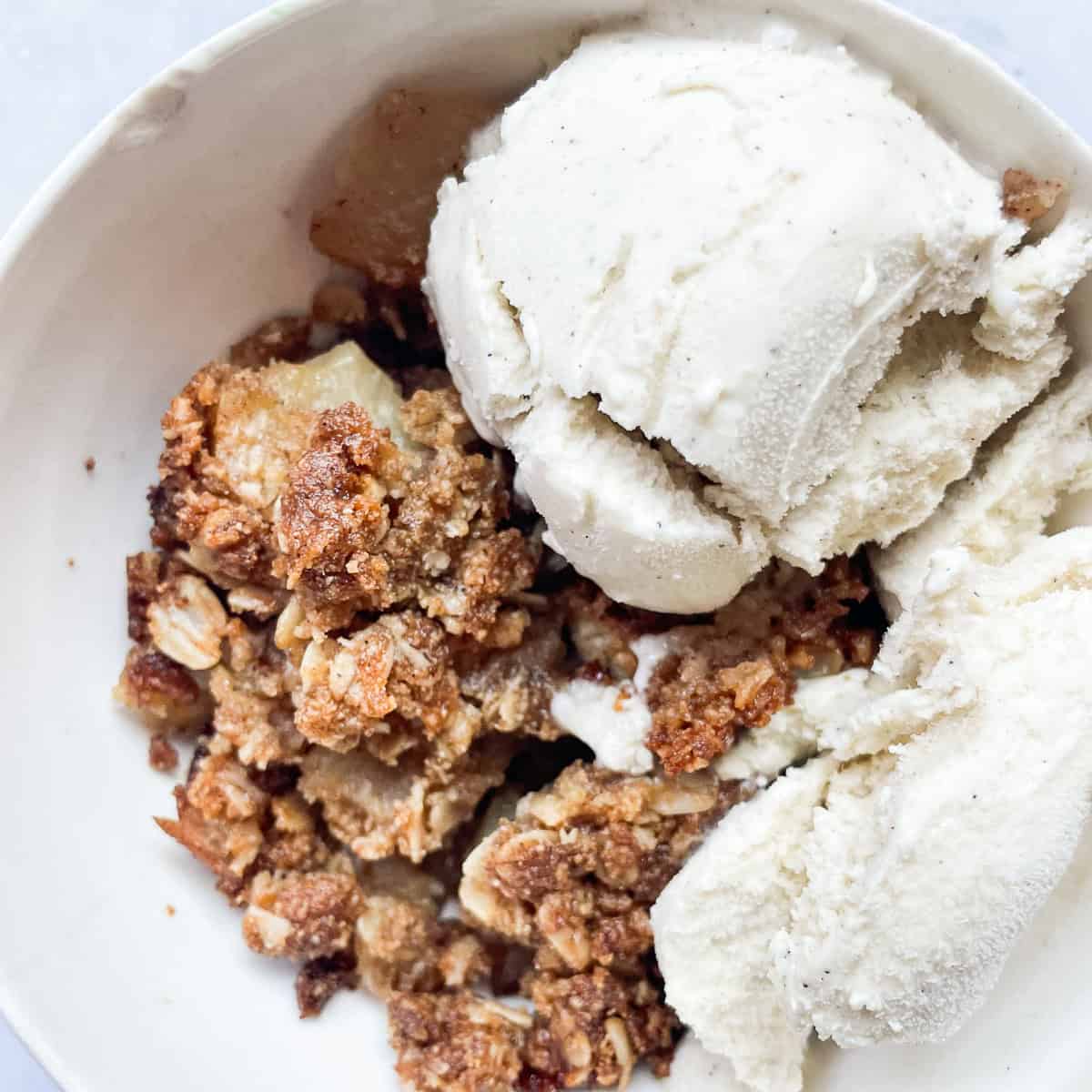 Ice cream tops apple crisp.