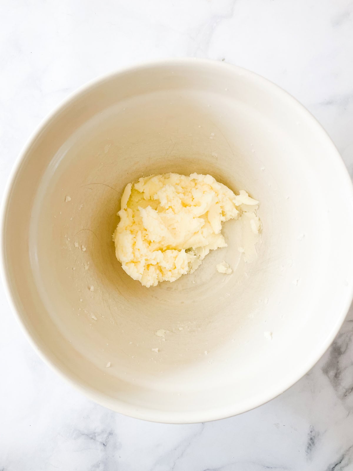 Butter and sugar creamed in a bowl.