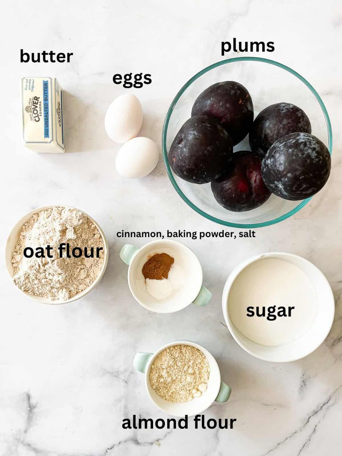 Ingredients for plum torte are labeled and portioned.