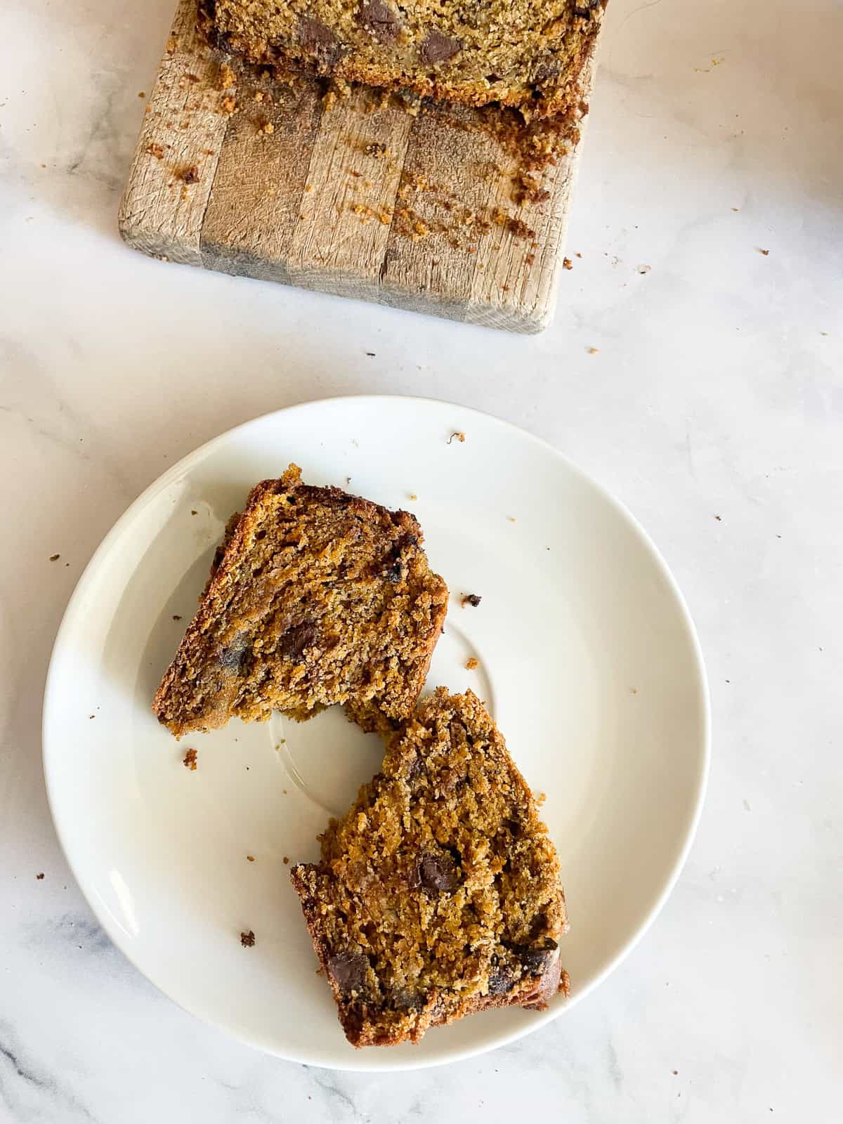 A slice of pumpkin banana bread on a plate.