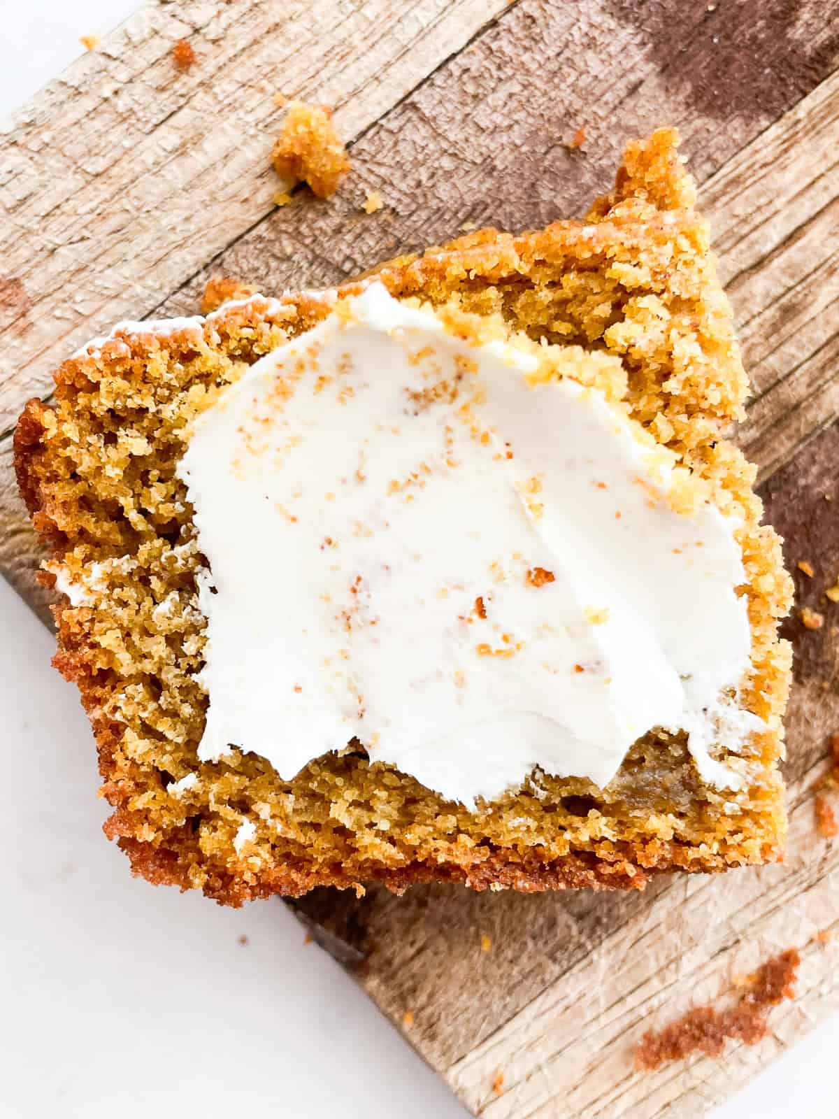 Cream cheese on pumpkin bread.