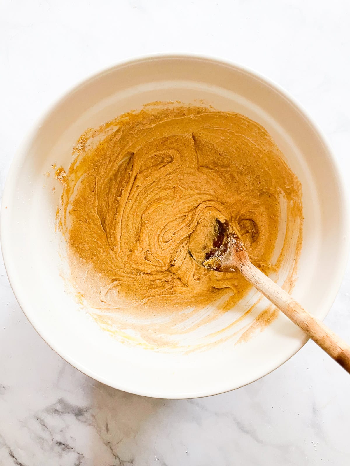 Wet ingredients are added to a batter.