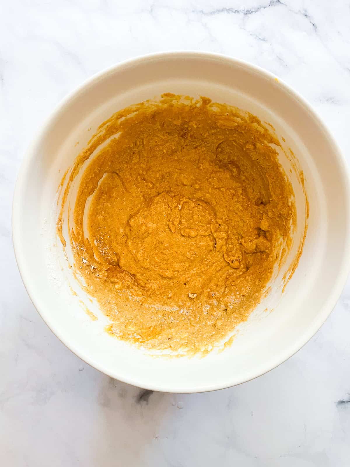 Combined batter for pumpkin banana bread in a bowl.