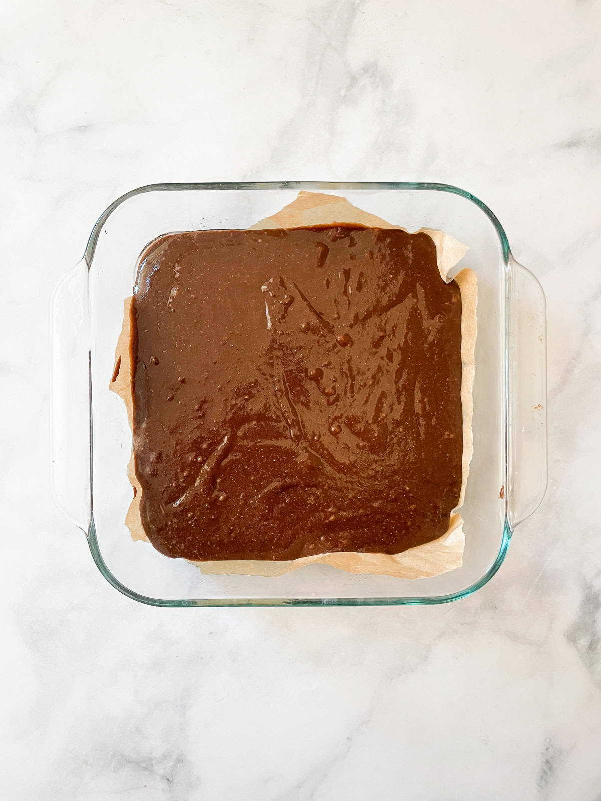 Brownie batter in a baking dish.