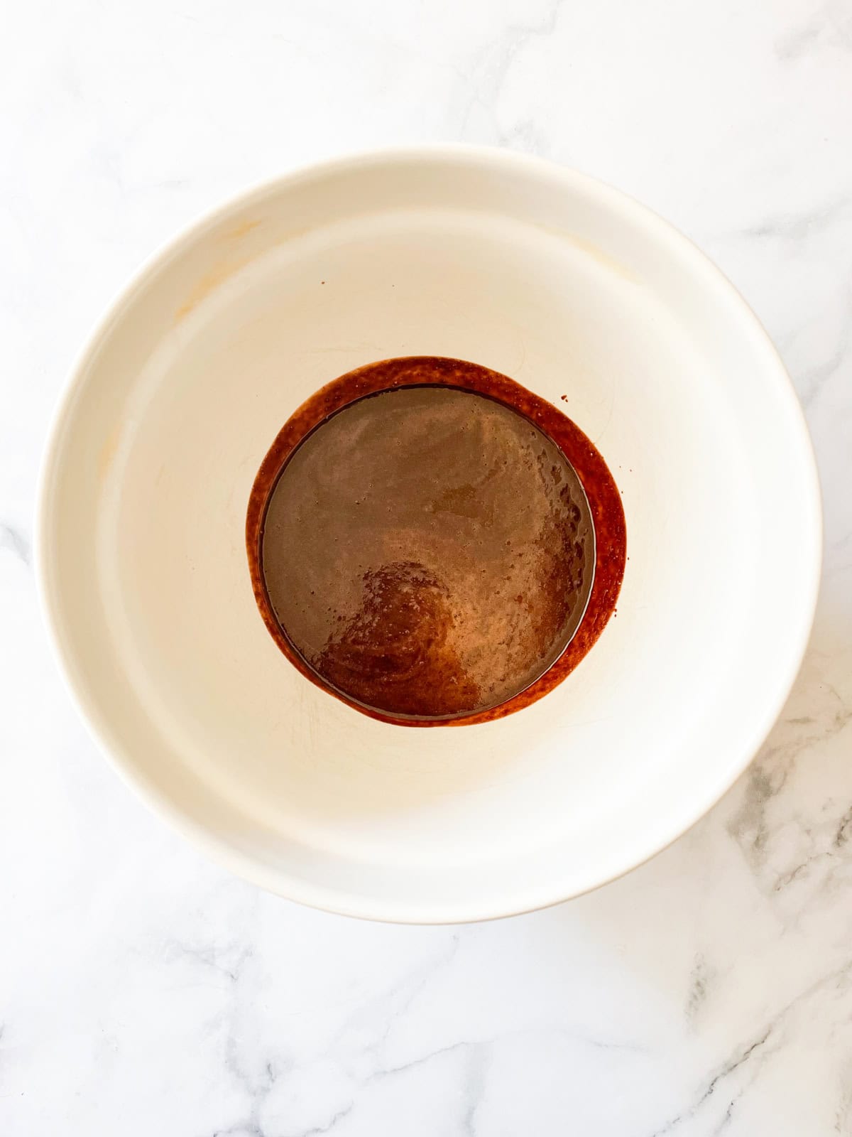 Melted chocolate and butter in a bowl.