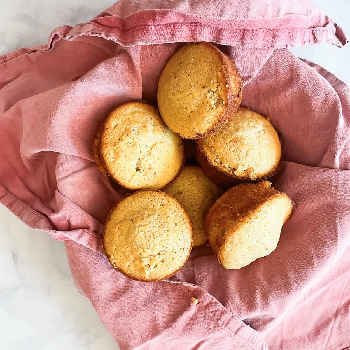 Cornbread muffins on a red napkin.