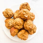 A plate of gluten free pumpkin banana muffins.