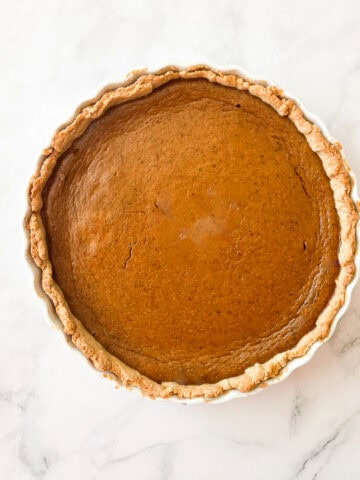 A gluten free pumpkin pie on a counter.