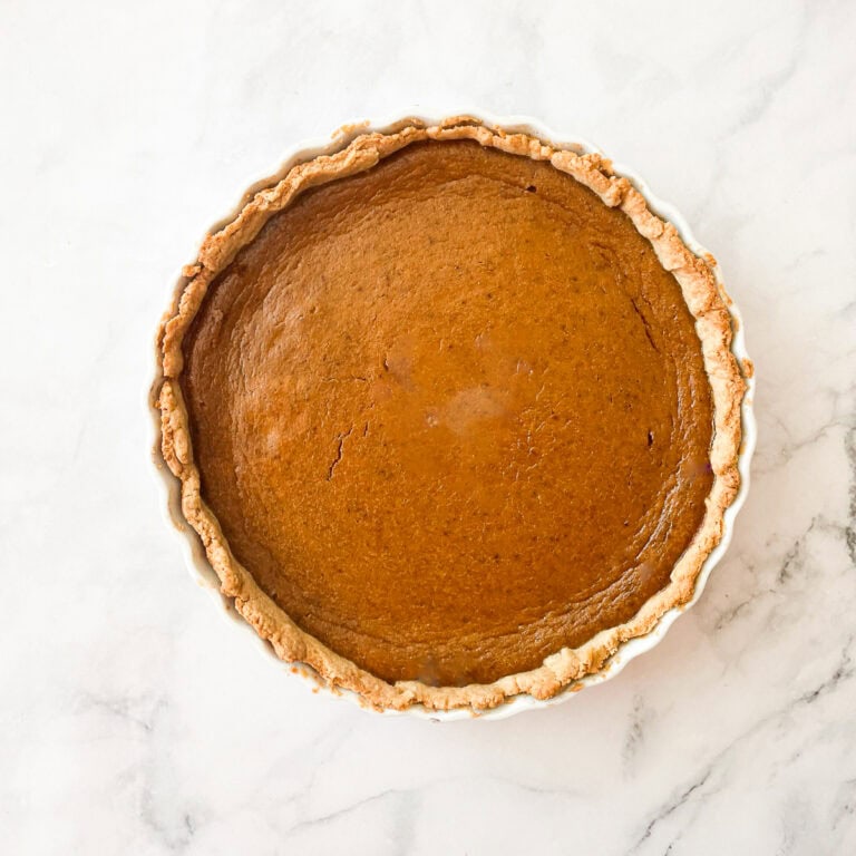 A gluten free pumpkin pie on a counter.