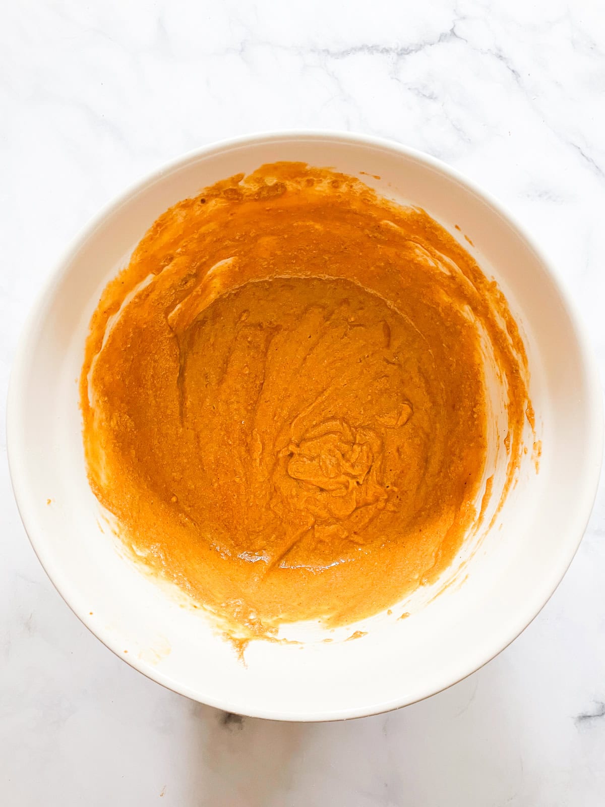 Pumpkin chocolate chip bread batter in a bowl.