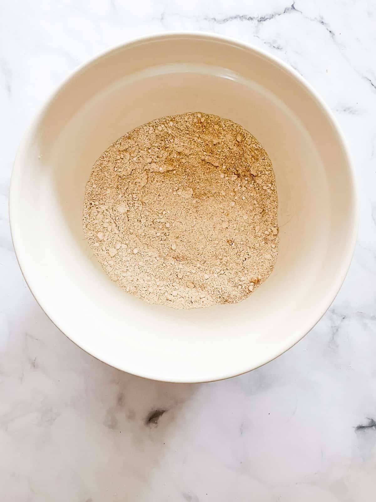 Dry mix for pumpkin chocolate chip bread in a bowl.