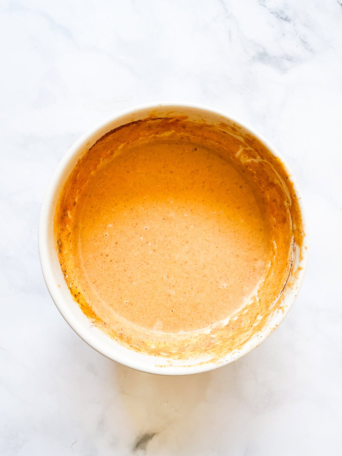 Gluten free pumpkin pie filling in a bowl.