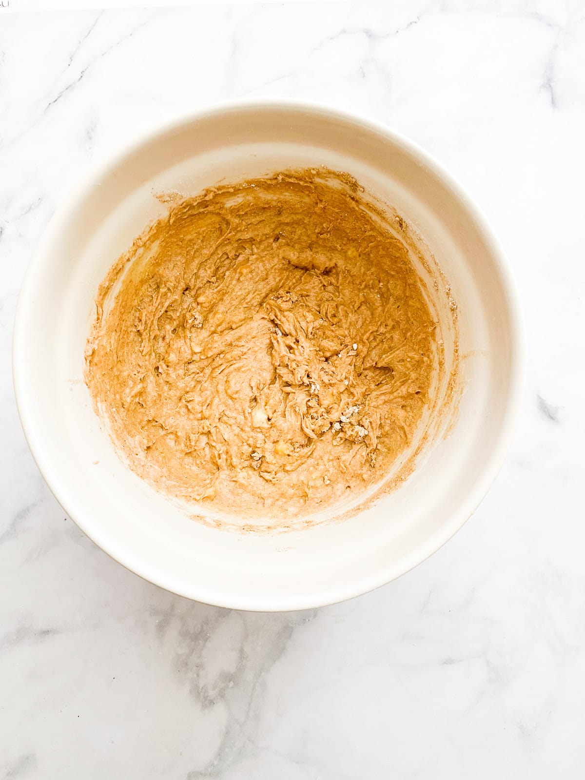 Dry ingredients are added to oat flour banana bread batter.