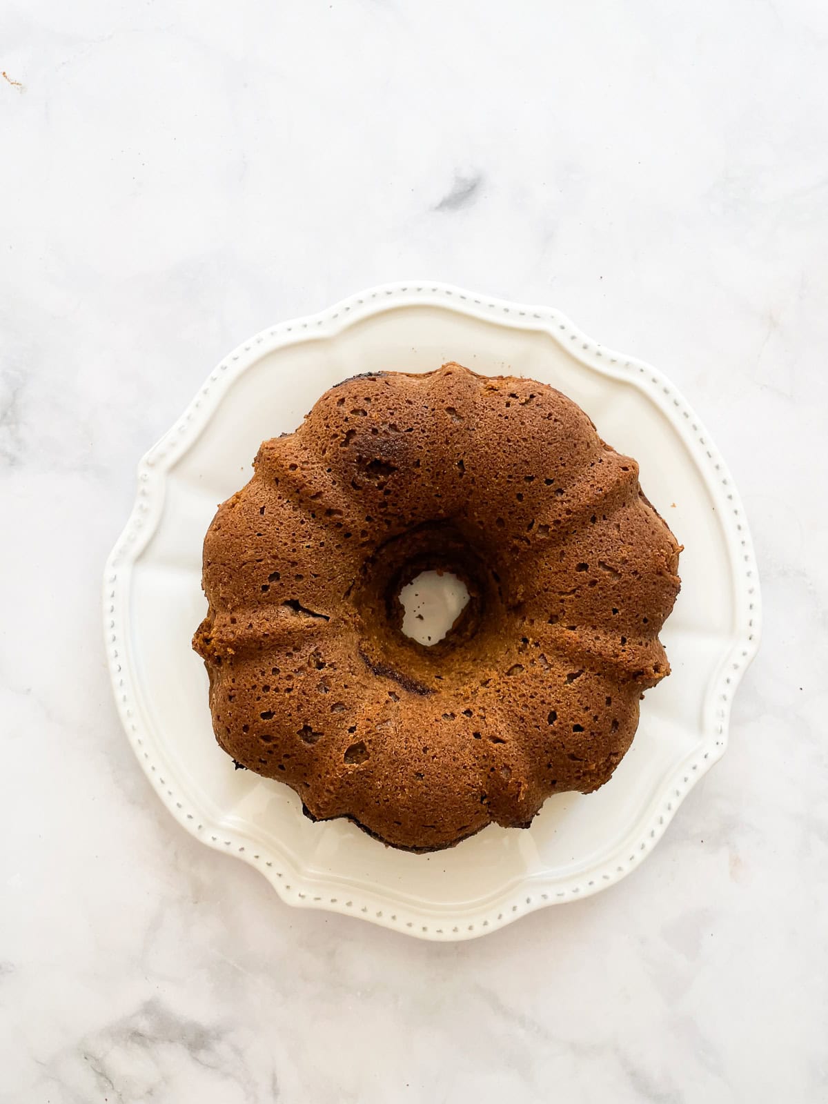 A pumpkin spice cake on a plate.