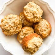 Leftover oatmeal muffins in a white bowl.