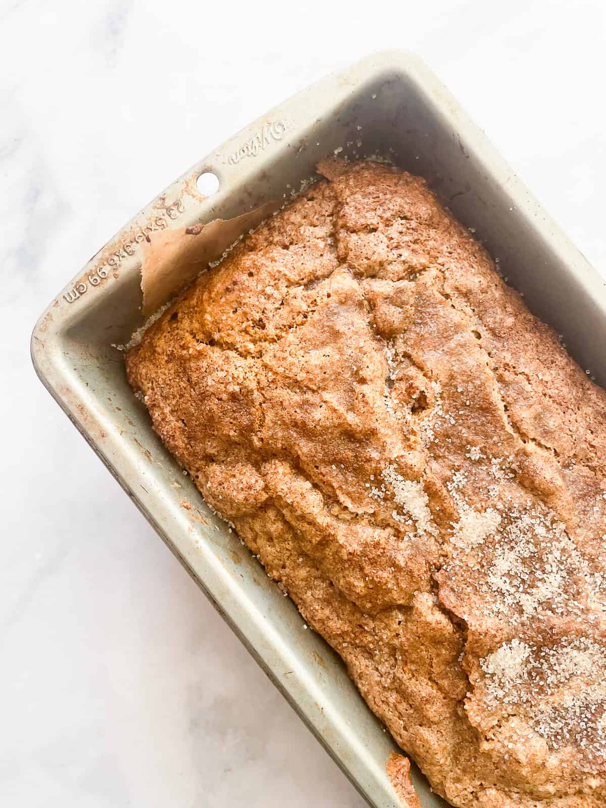 A crackly-topped loaf of oat flour banana bread.