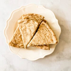 A plate holds triangles of gluten free shortbread.