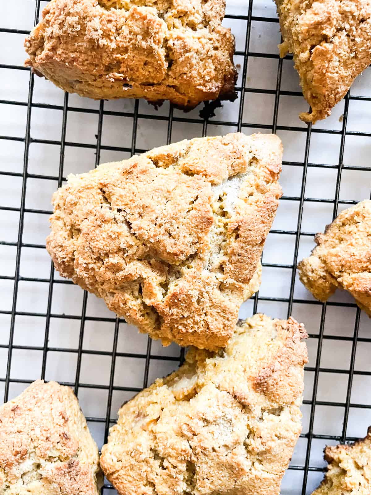 Gluten free walnut pumpkin scones on a rack.