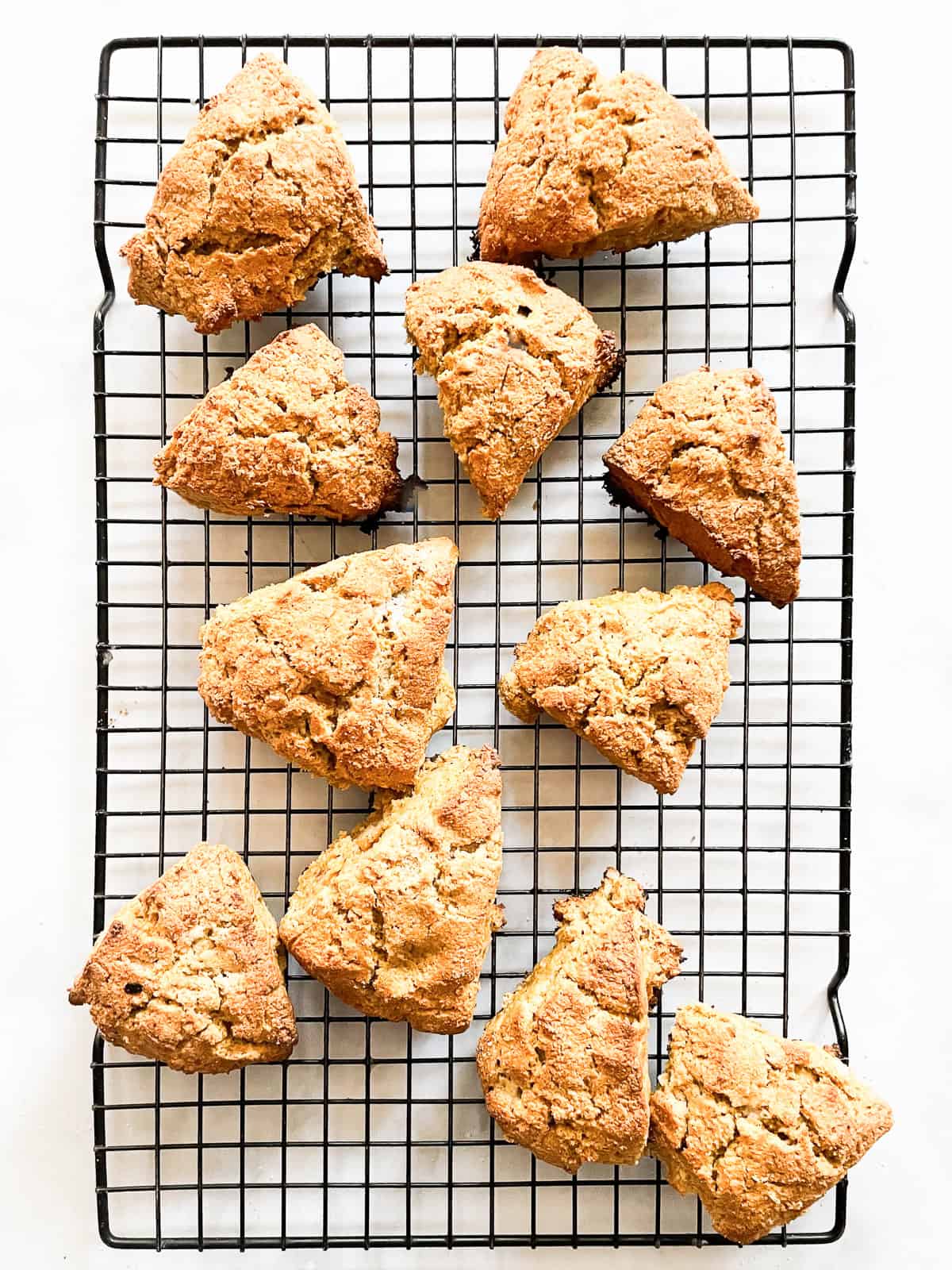 Gluten free walnut pumpkin scones on a rack.