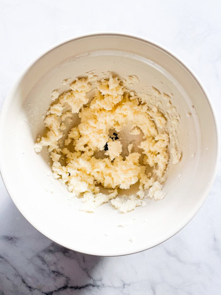 Butter and maple sugar creamed in a bowl.