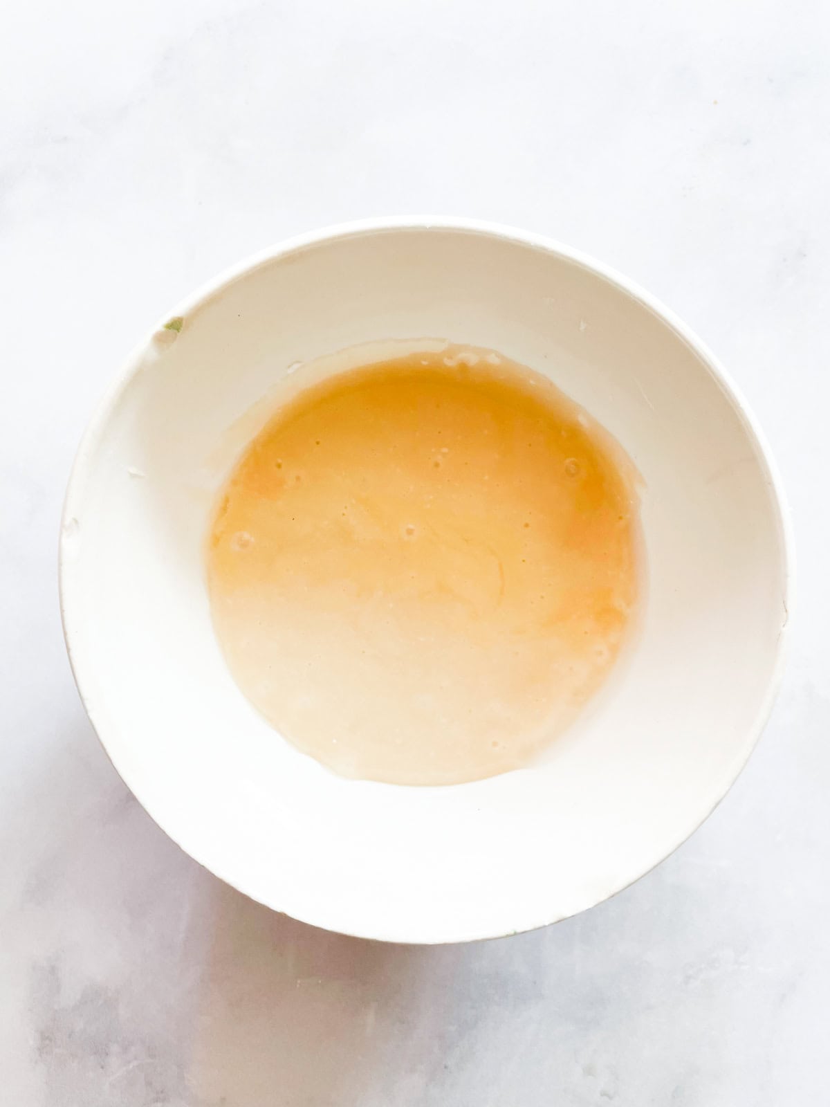 Glaze for pumpkin bundt cake in a bowl.