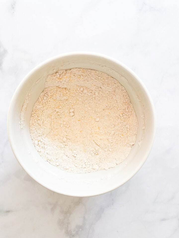 The dry mix for pumpkin cornbread in a bowl.