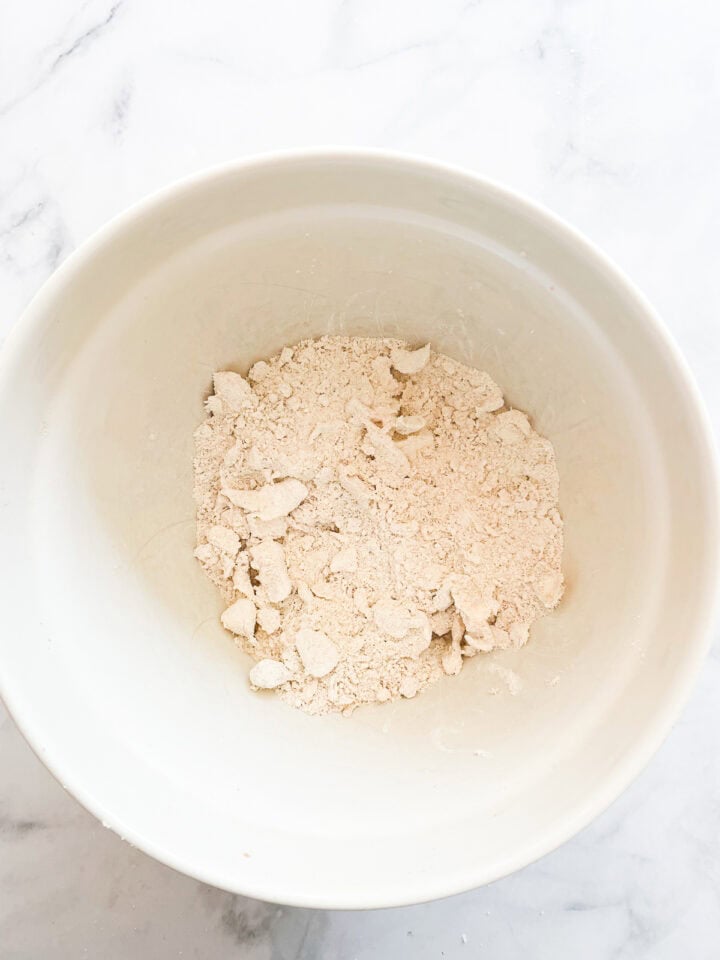 Butter is worked into sweet potato biscuits dough.