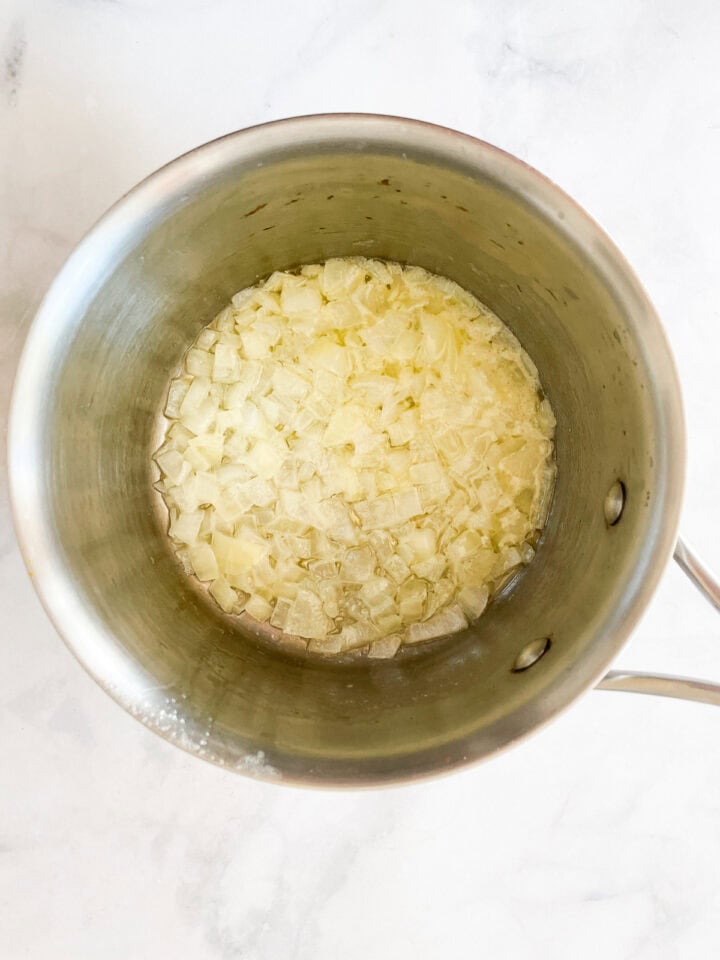 Onions and garlic cook in olive oil.