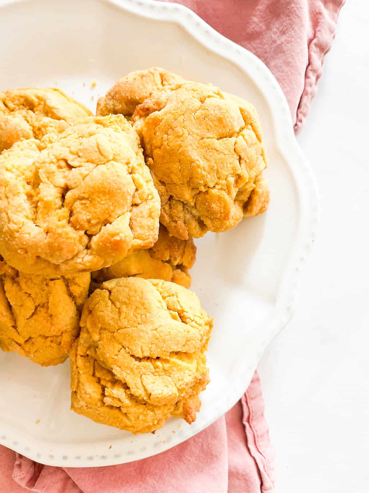 A plate of sweet potato biscuits on a red napkin.