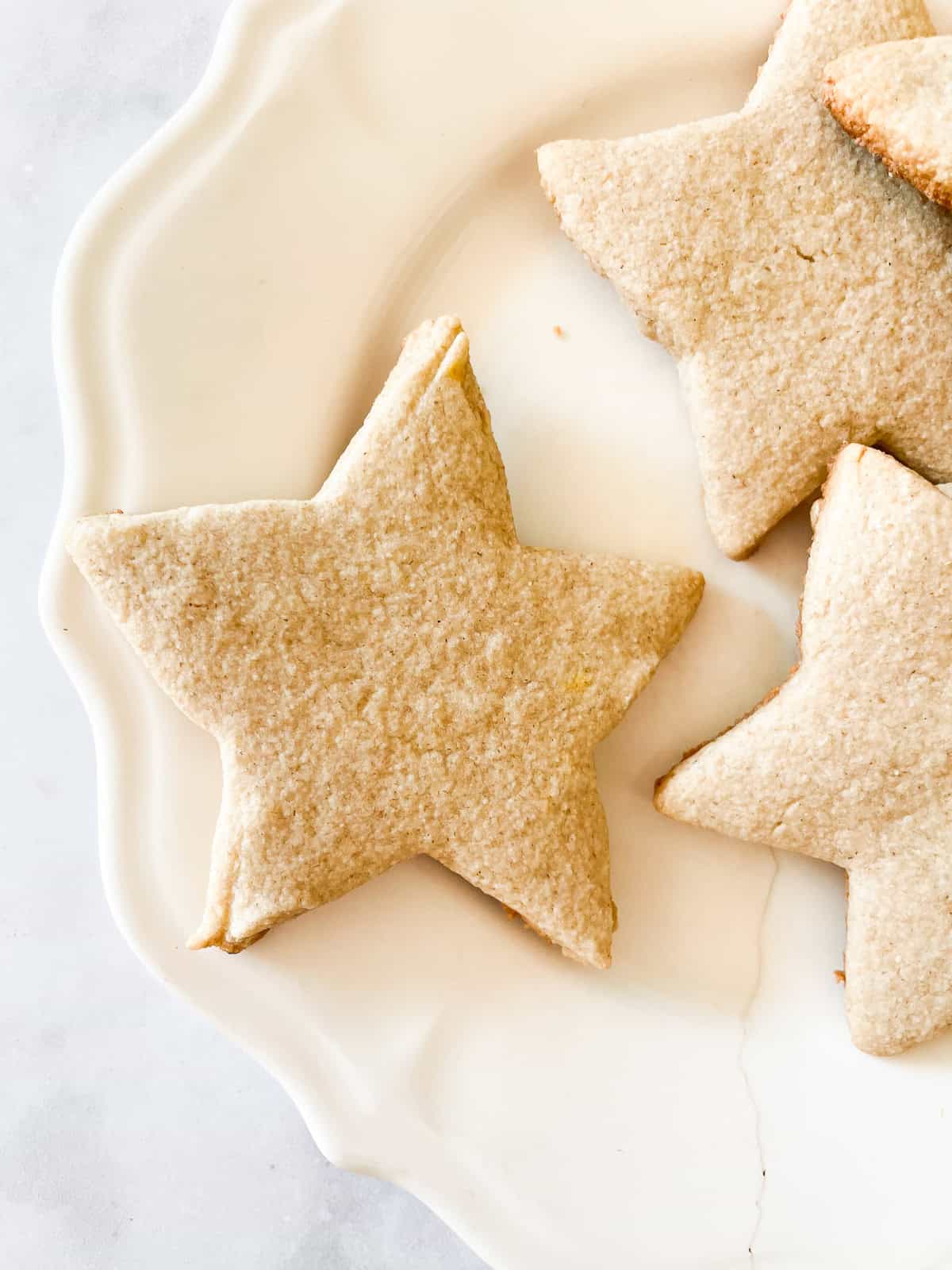 Icing sugar on top of gluten free sugar cookies.